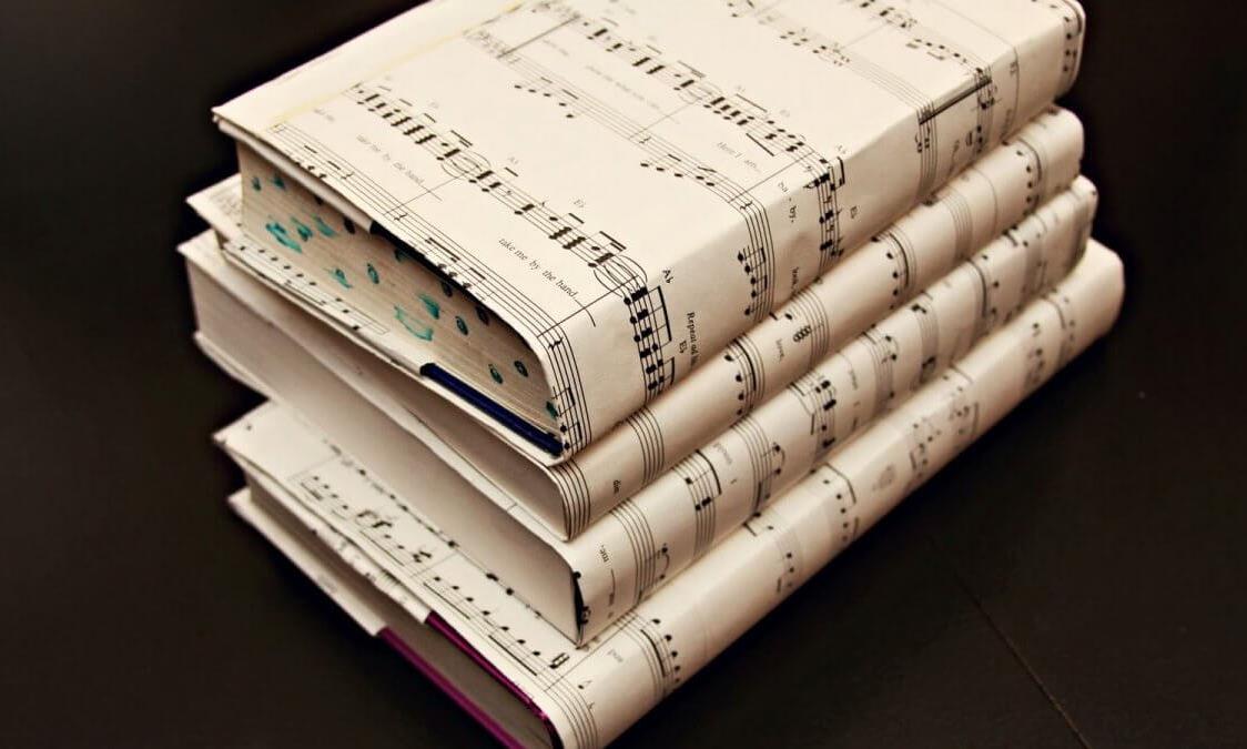 Music Books Stack My Novel-in-Progress Needed a Soundtrack. Yours May Too. | Janna G. Noelle